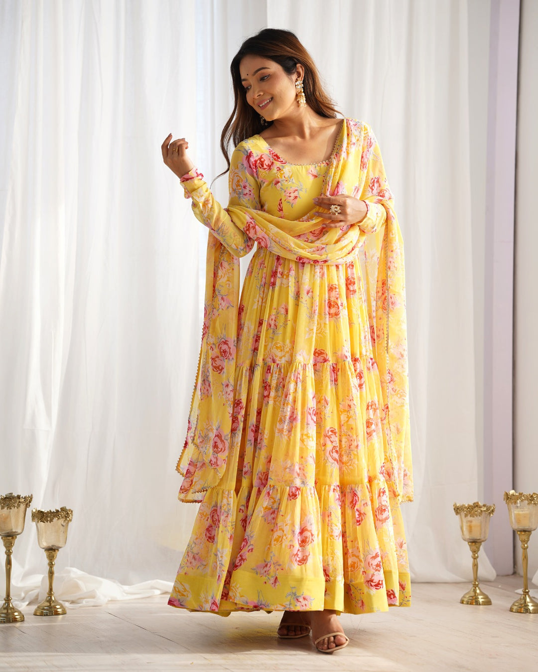 Beautiful yellow heavy pure soft fox georgette floral print anarkali suit on display