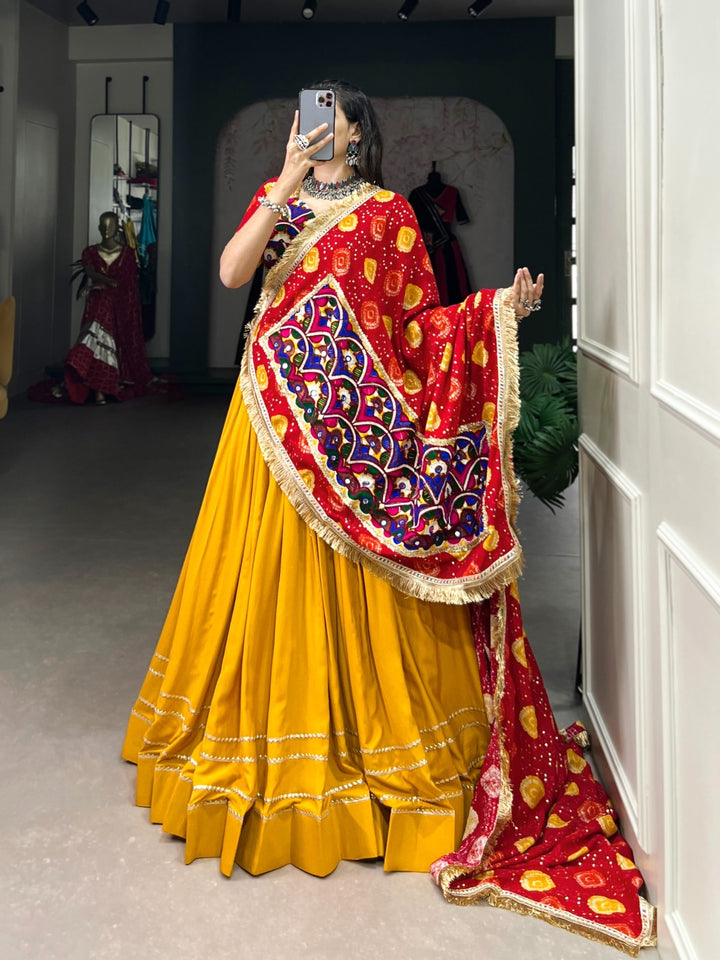 Yellow pure rayon lehenga with intricate gota patti detailing on the hem