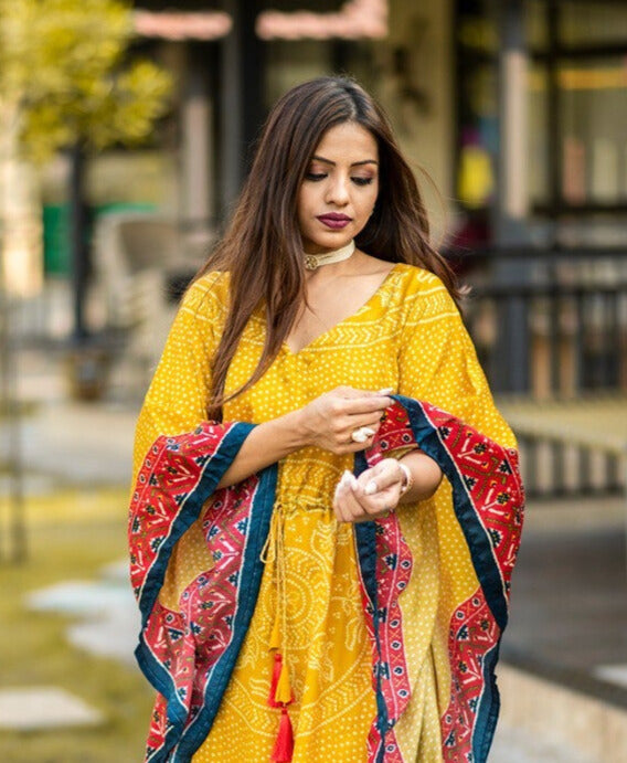 Beautiful Mustard Pure Gaji Silk Digital Print Kaftan Dress with Gotta Patti Lace Border and Tassels