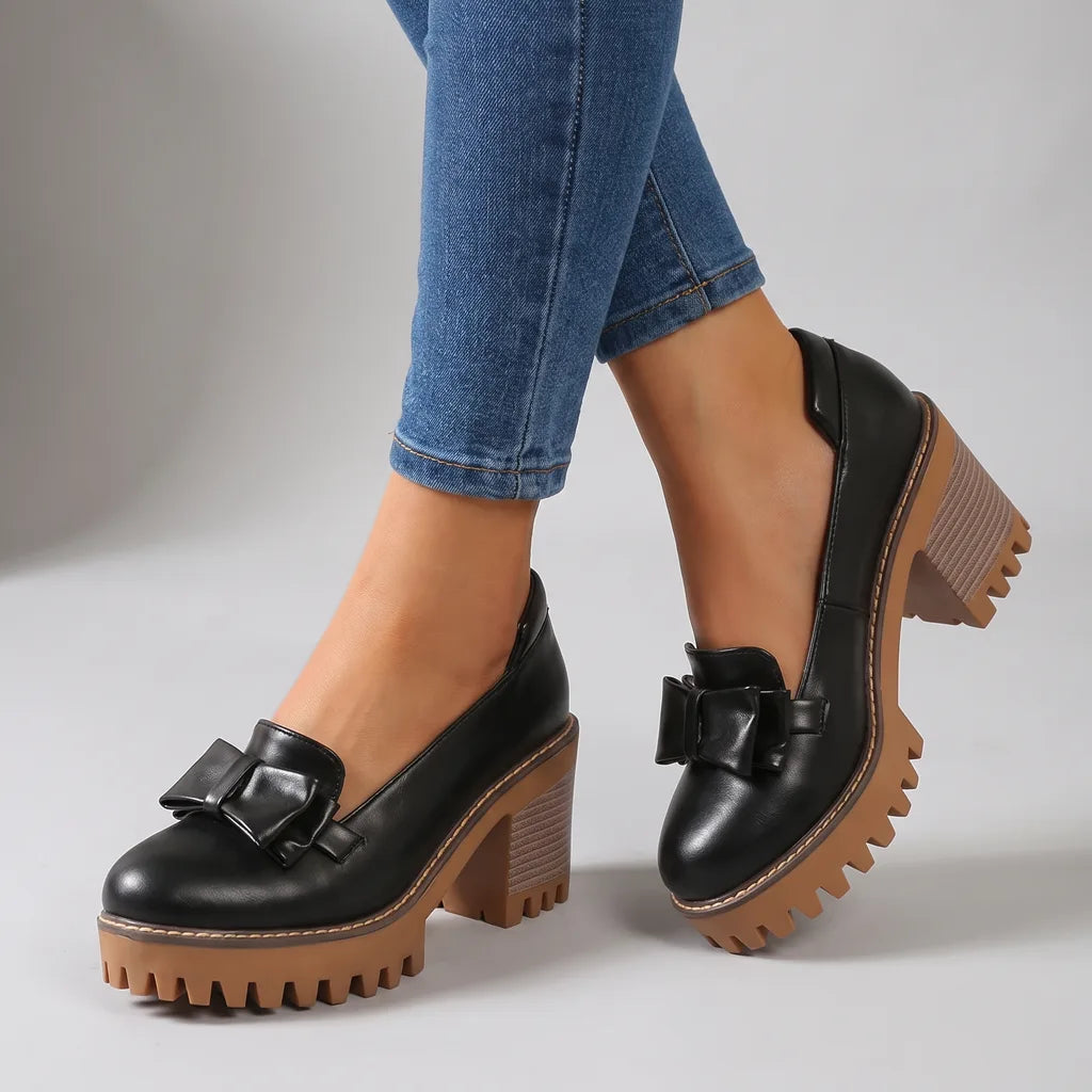 Black women's orthopedic platform shoes with bow detail by Hudson Ridge, featuring comfortable heels and stylish design.