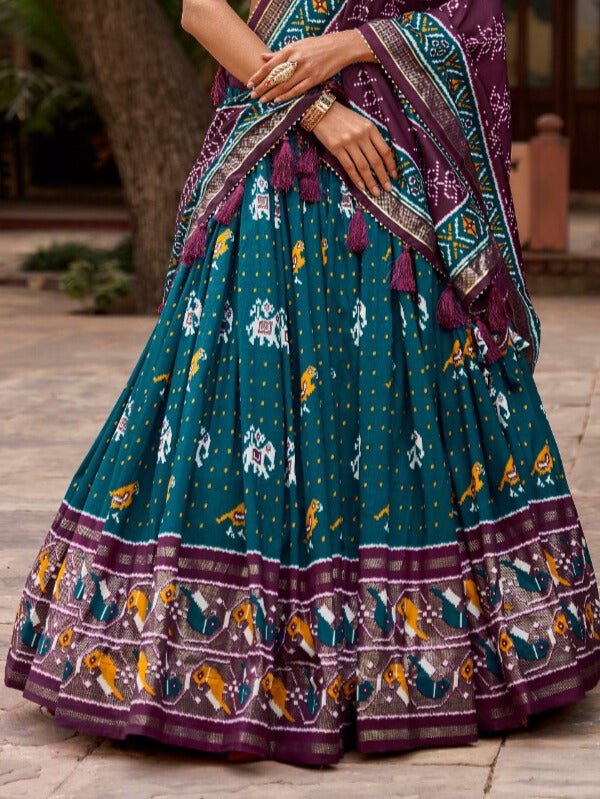 Tussar silk and the mesmerizing allure of ikkat Patola prints lehenga choli in Teal Color