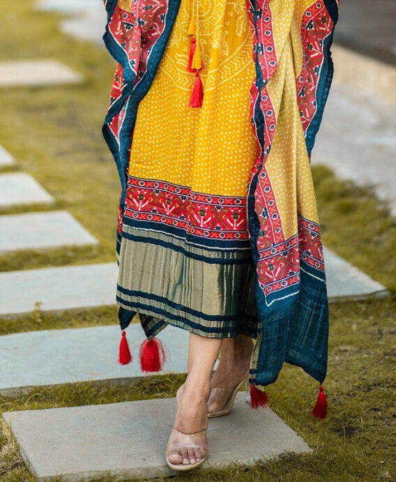 Beautiful mustard pure gaji silk kaftan dress with digital print, gotta patti lace border, and tassels