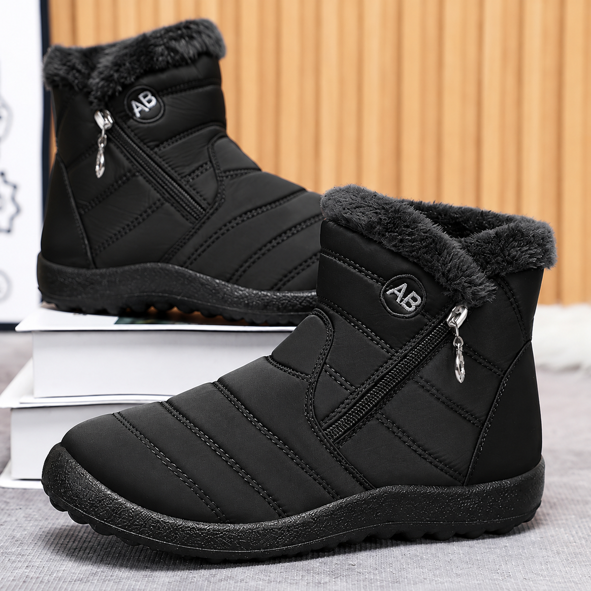 Women's Bootara Norwyn snow boots in black with water-resistant exterior, fleece lining, high-top design, and side zipper.
