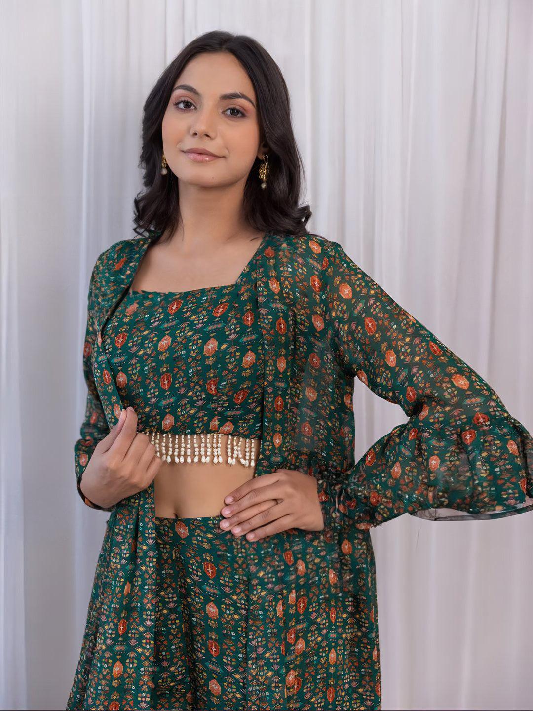 Fashionable Qivii outfit with a crop-top and sharara in bottle green georgette