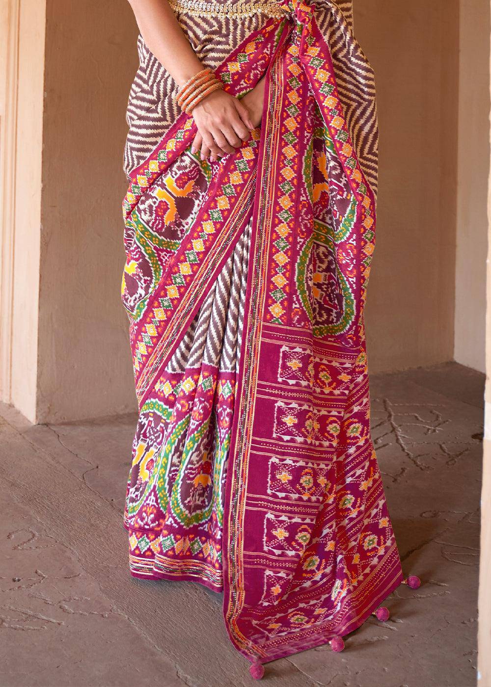 Brown & Pink Printed Patola Silk Saree with Zari Border & Tassels on Pallu | Stitched Blouse - qivii