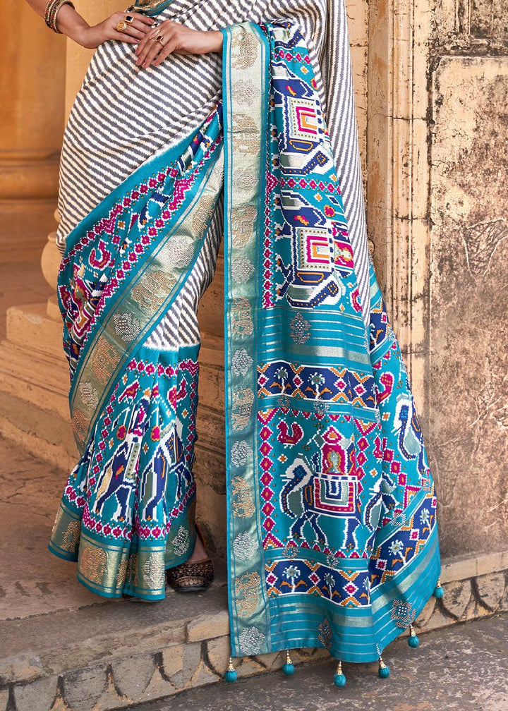 Cerulean Blue Designer Patola Silk Saree with Zari Border & Stone work(Pre-Order) | Stitched Blouse - qivii
