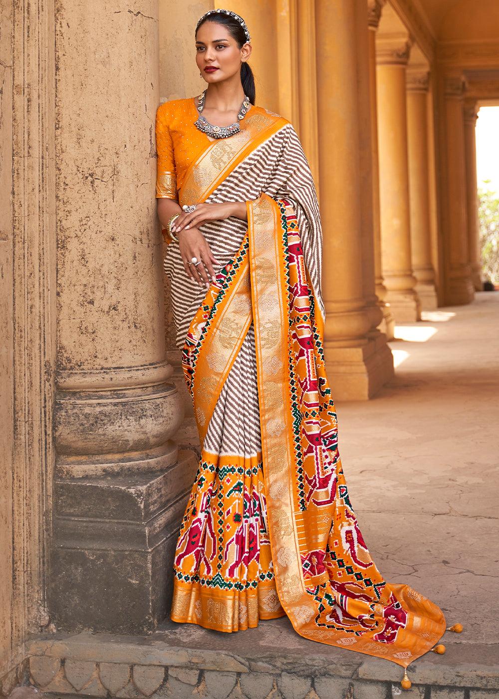 Chrome Yellow Designer Patola Silk Saree with Zari Border & Stone work | Stitched Blouse - qivii