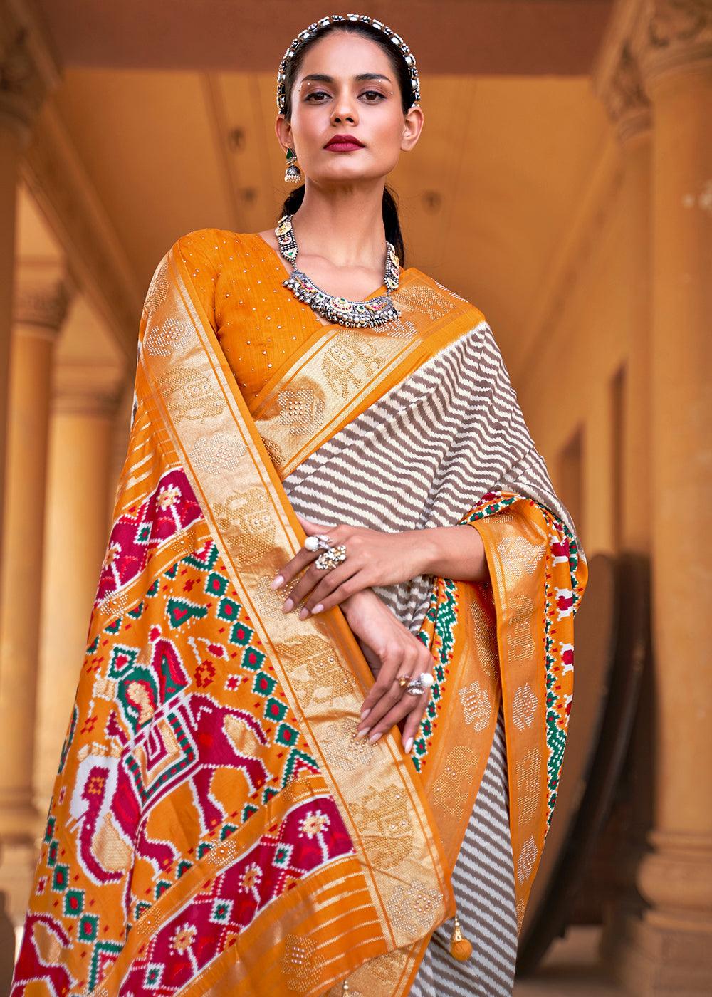 Chrome Yellow Designer Patola Silk Saree with Zari Border & Stone work | Stitched Blouse - qivii