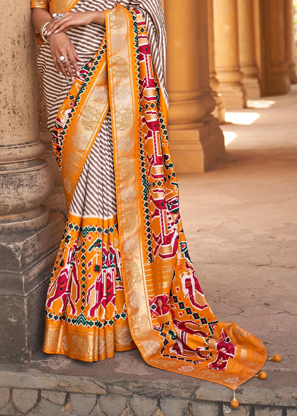 Chrome Yellow Designer Patola Silk Saree with Zari Border & Stone work | Stitched Blouse - qivii