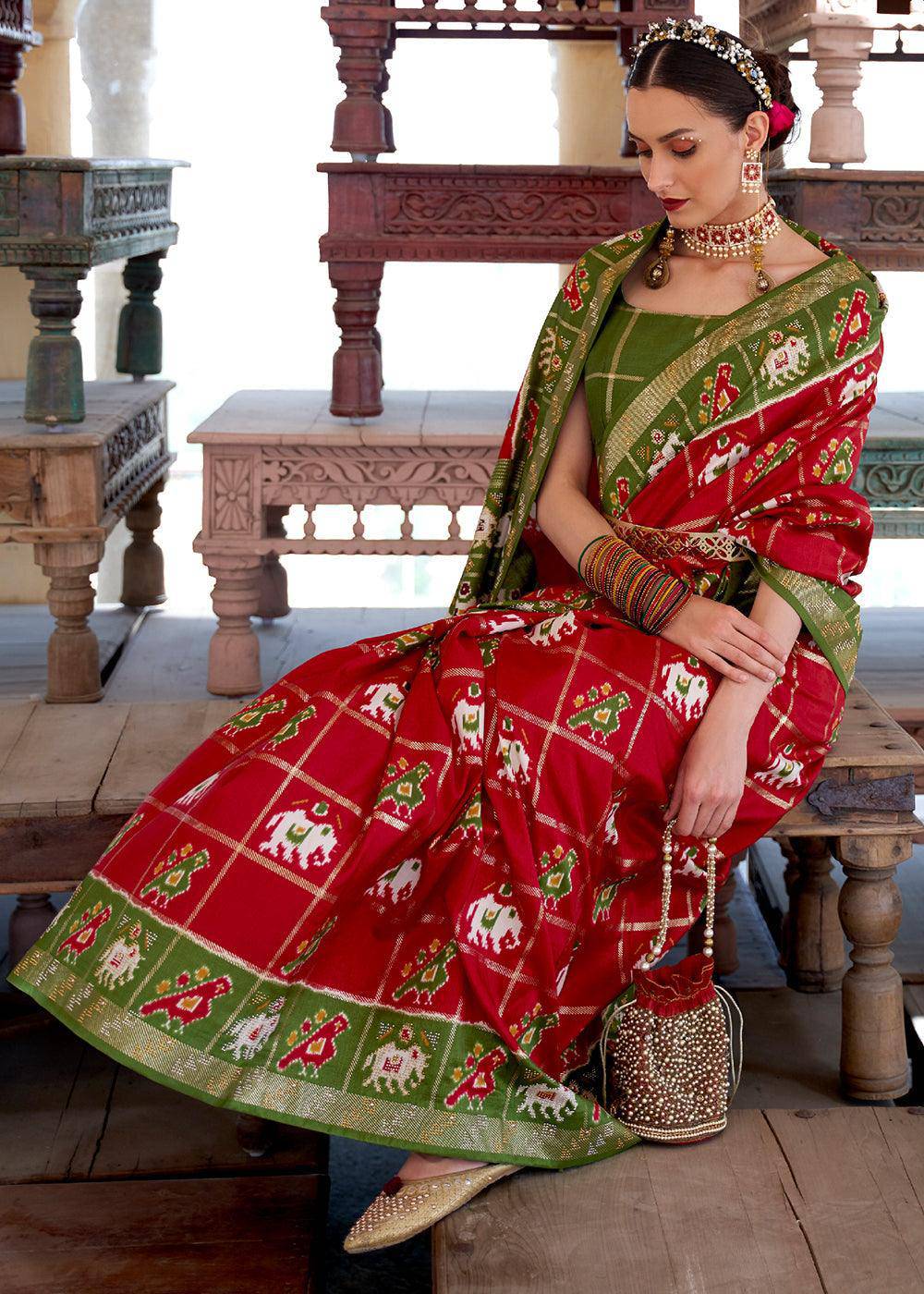 Crimson Red Printed Patola Silk Saree with Zari Border & Tassels on Pallu | Stitched Blouse - qivii