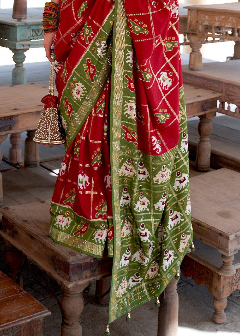 Crimson Red Printed Patola Silk Saree with Zari Border & Tassels on Pallu | Stitched Blouse - qivii