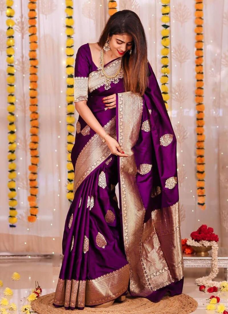 Traditional Indian attire in a rich purple hue with elegant silk fabric and detailed design