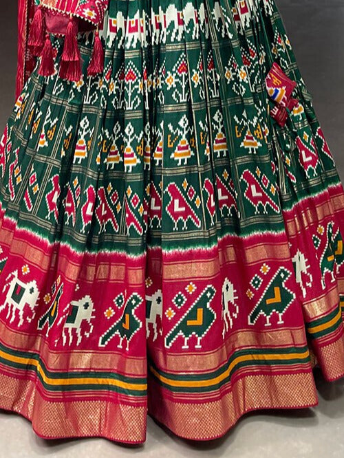 Tussar Silk Patola Print With Foil Work Lehenga Choli In Green Color