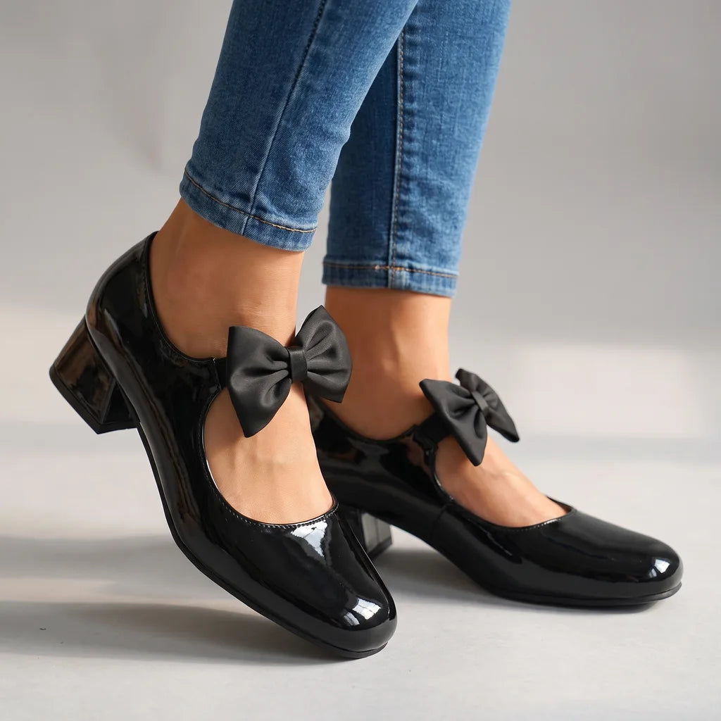 Black Doris women's bow-tie Mary Jane heels by Hudson Ridge, stylish footwear with a classic strap design and feminine bow detail.
