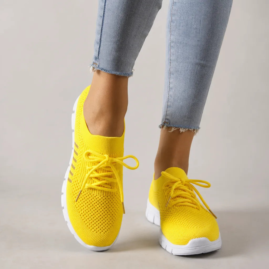 Yellow women's orthopedic walking sneakers by Qivii, designed for comfort and support, featuring a breathable upper and cushioned sole.
