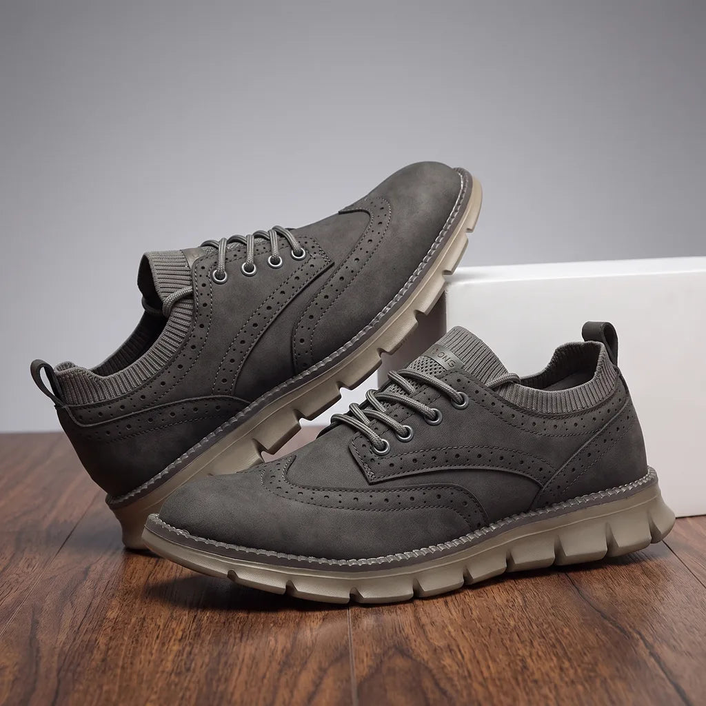 Gray men's casual sneakers by Qivii from Hudson Ridge, featuring a comfortable loafer-style design for everyday wear.