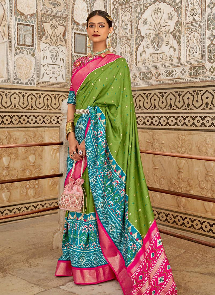 Enchanting Green Color Patola Printed Silk Saree With Boat Neck Blouse  - By Kreeva