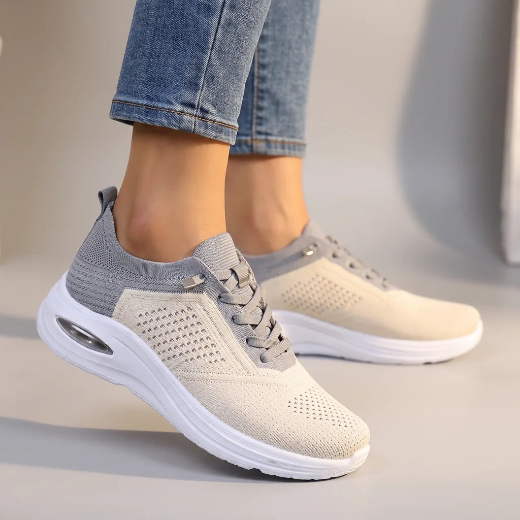 Gray women's orthopedic mesh sneakers by Qivii from Hudson Ridge, featuring breathable mesh and supportive sole for comfortable footwear.