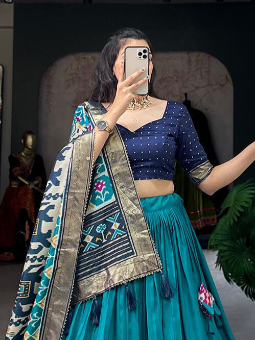 Tussar Silk Patola Print With Foil Work Lehenga Choli In Teal Color