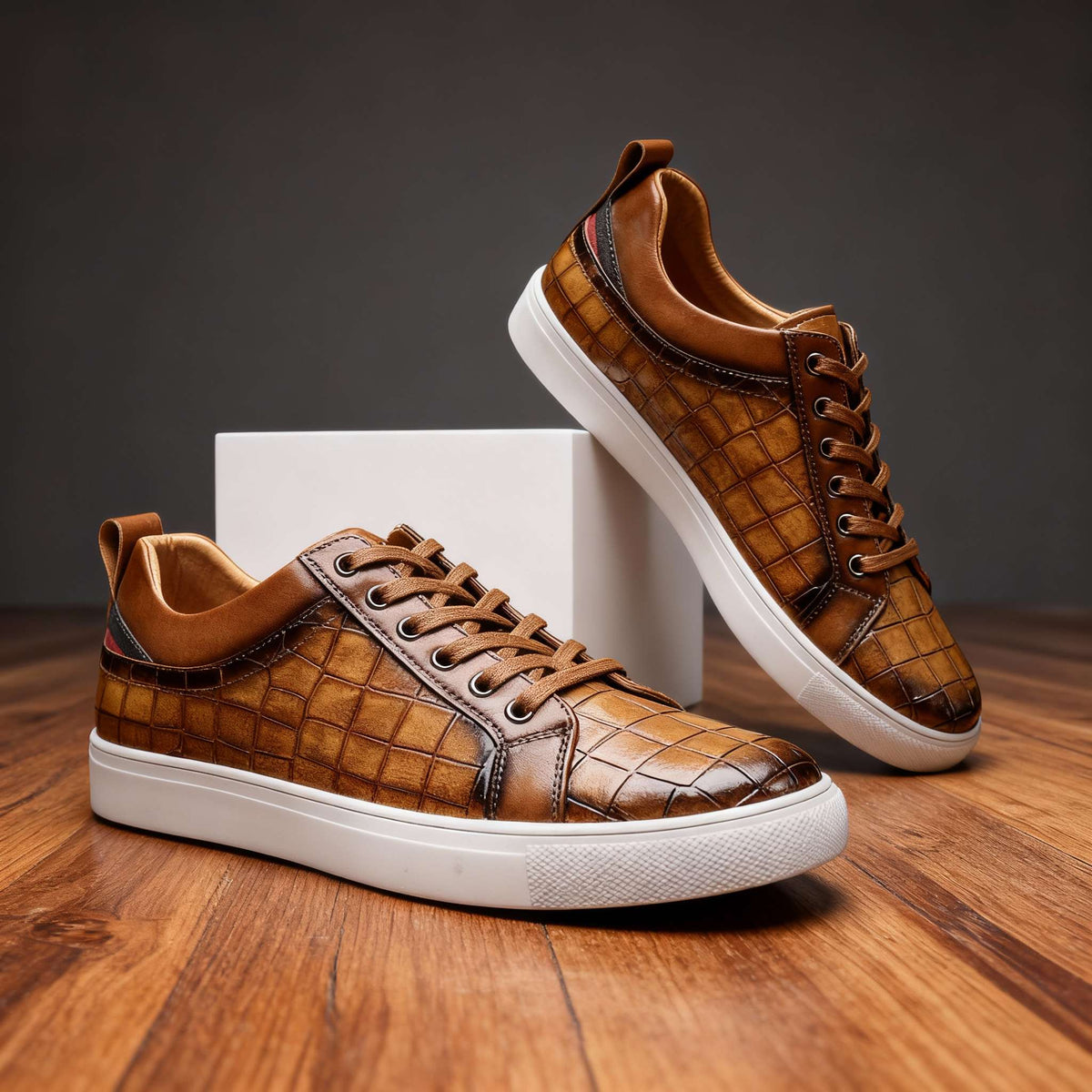 Close-up of men's leather sneakers by Hudson Ridge, featuring stylish black leather uppers and casual design from Charles Ray.