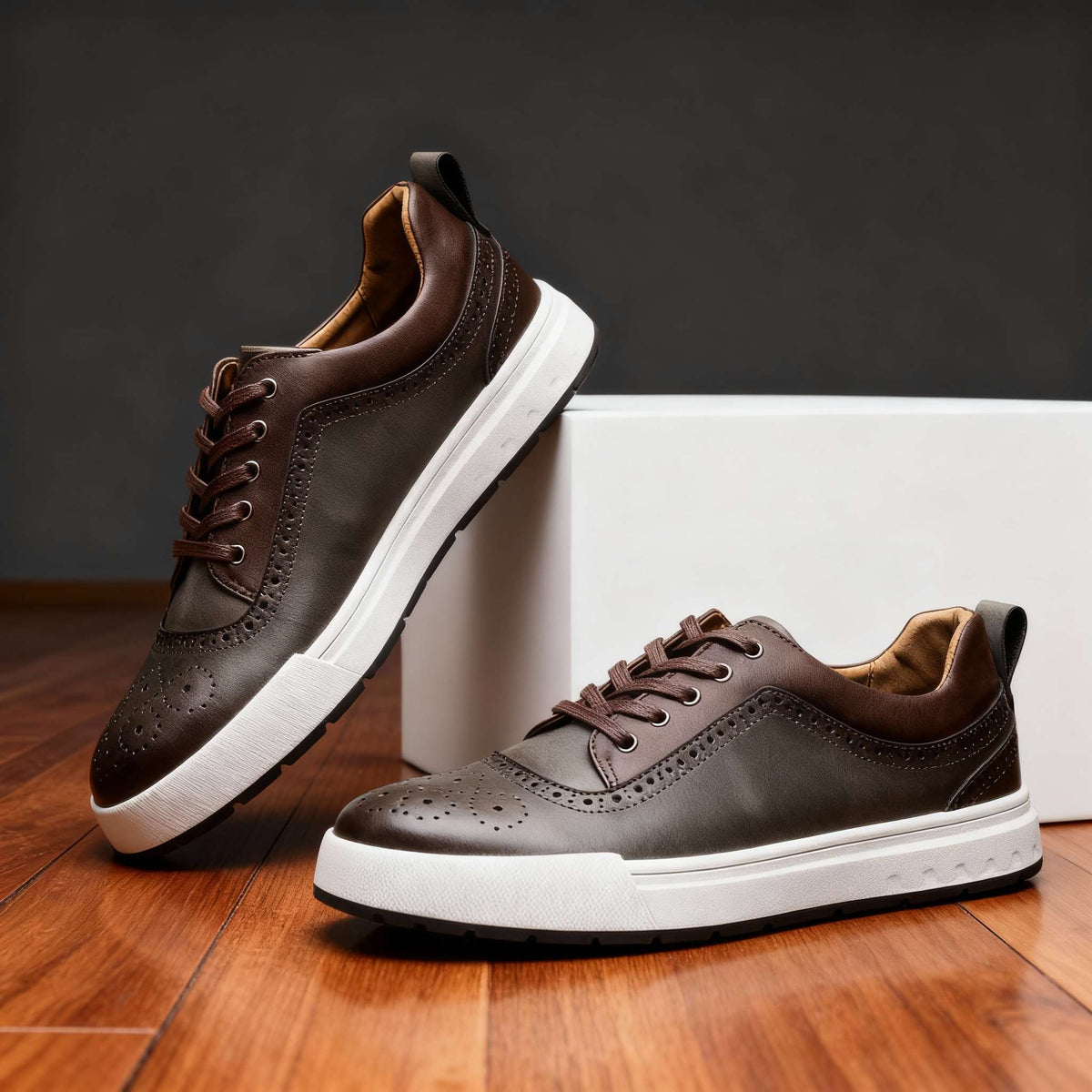 Close-up of men's leather sneakers by Qivii, featuring Hudson Ridge branding, showcasing detailed stitching and sleek design.