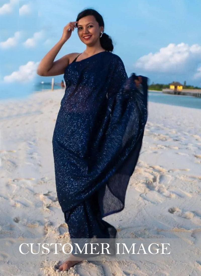 Beautifully crafted navy blue sequins saree paired with silk blouse