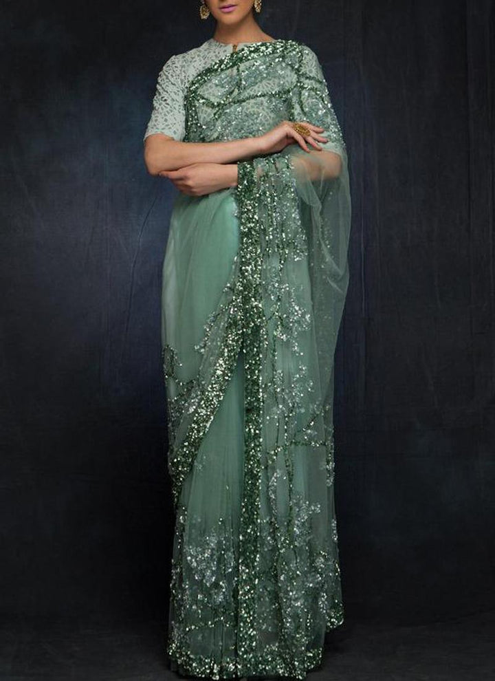 Glitzy Teal Green Color Soft Net With Sequins Base Saree  - By Kreeva