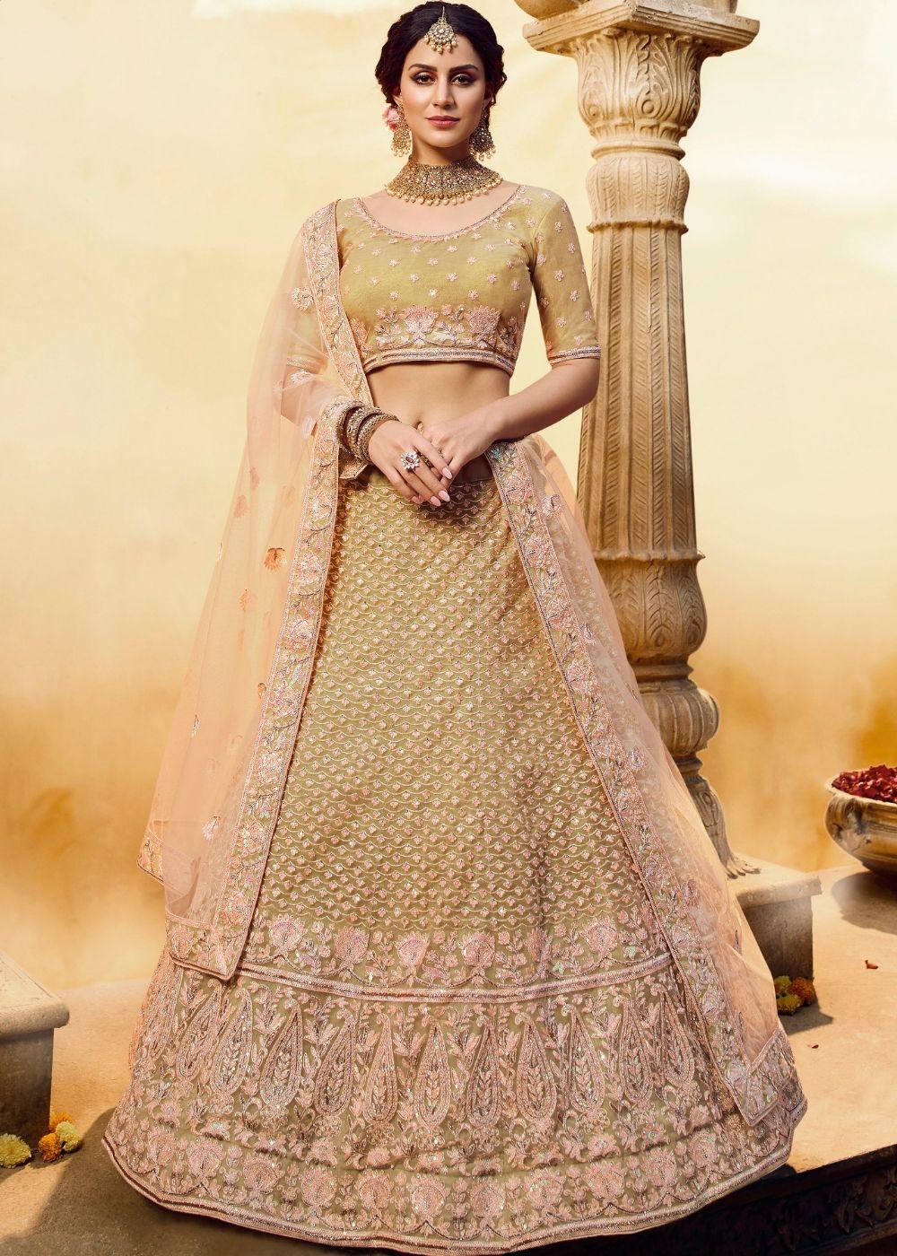 Golden Silk and Soft Net Bridal Lehenga Choli with Resham Embroidery and Aari work - qivii