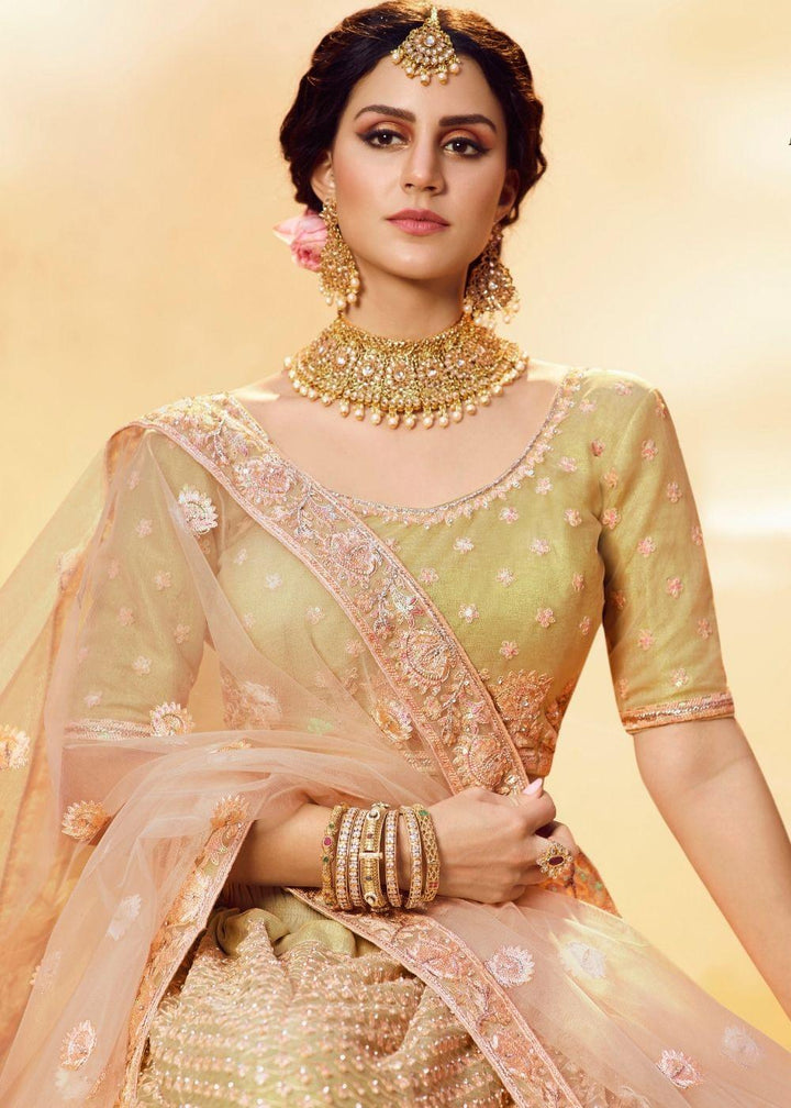 Golden Silk and Soft Net Bridal Lehenga Choli with Resham Embroidery and Aari work - qivii