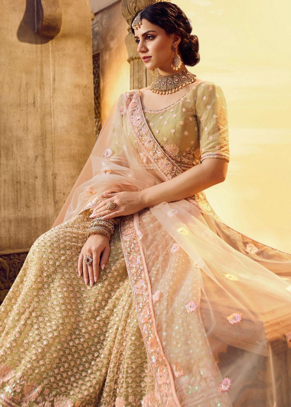 Golden Silk and Soft Net Bridal Lehenga Choli with Resham Embroidery and Aari work - qivii