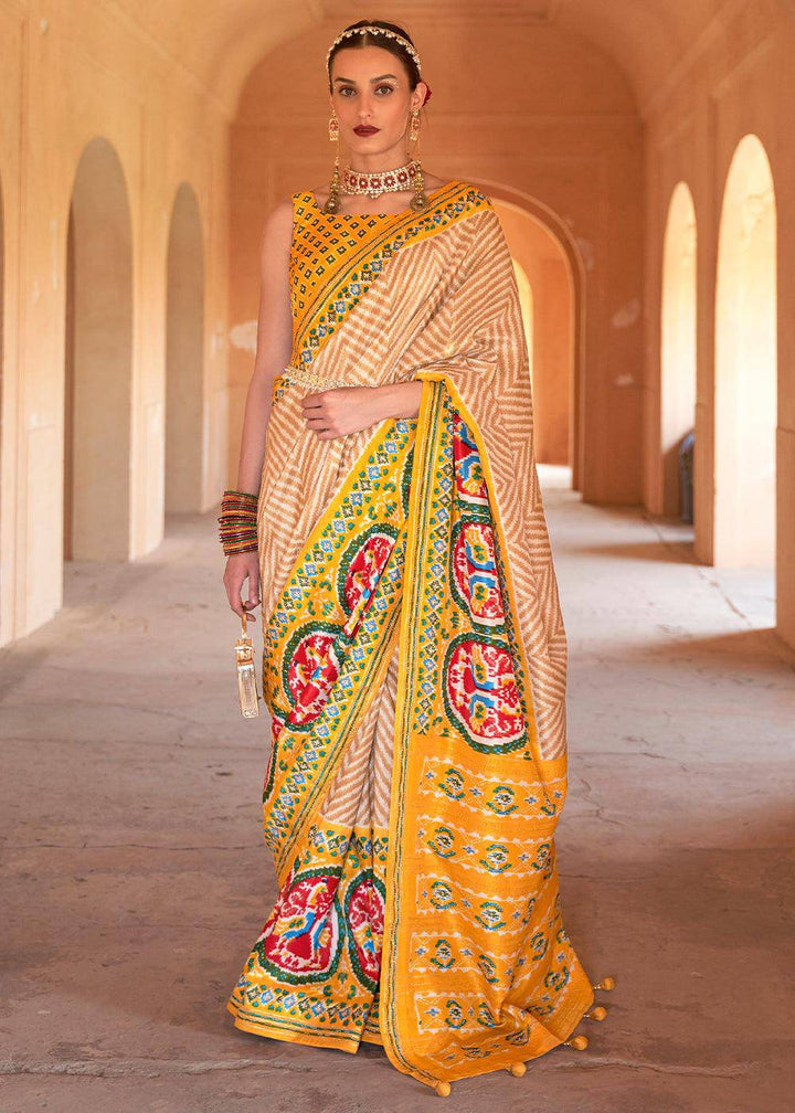 Golden Yellow Printed Patola Silk Saree with Zari Border & Tassels on Pallu | Stitched Blouse - qivii