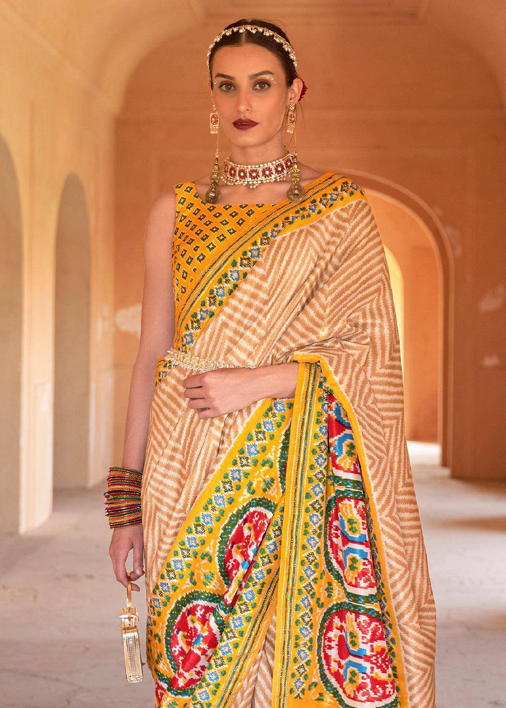 Golden Yellow Printed Patola Silk Saree with Zari Border & Tassels on Pallu | Stitched Blouse - qivii