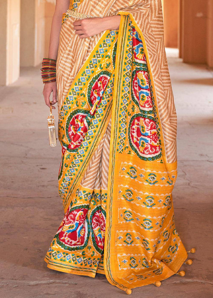 Golden Yellow Printed Patola Silk Saree with Zari Border & Tassels on Pallu | Stitched Blouse - qivii