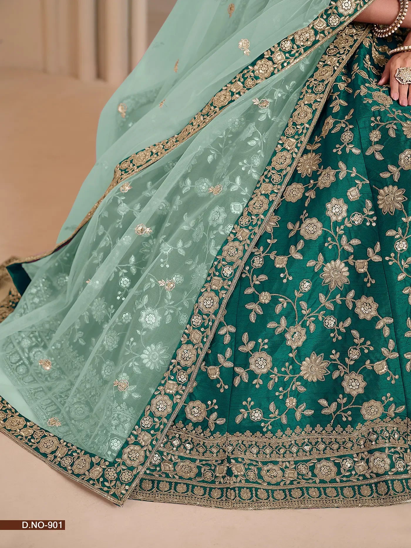 Embroidered teal and mint green lehenga saree with gold floral patterns