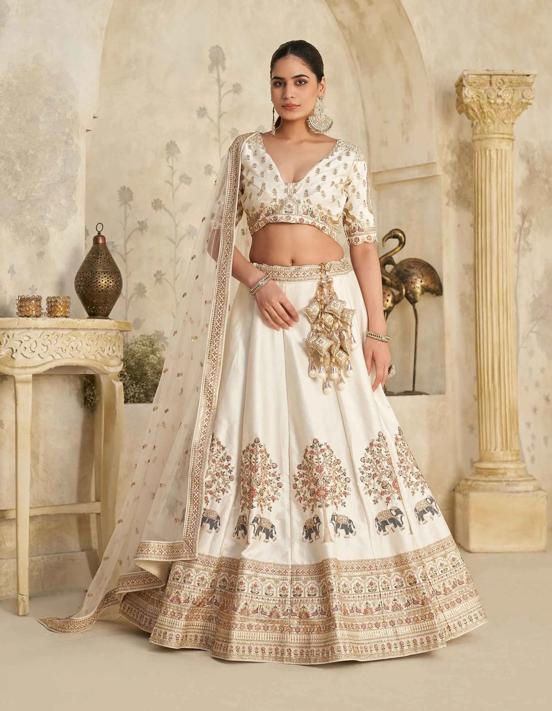 Cream Lehenga with Intricate Elephant Zari Work - qivii