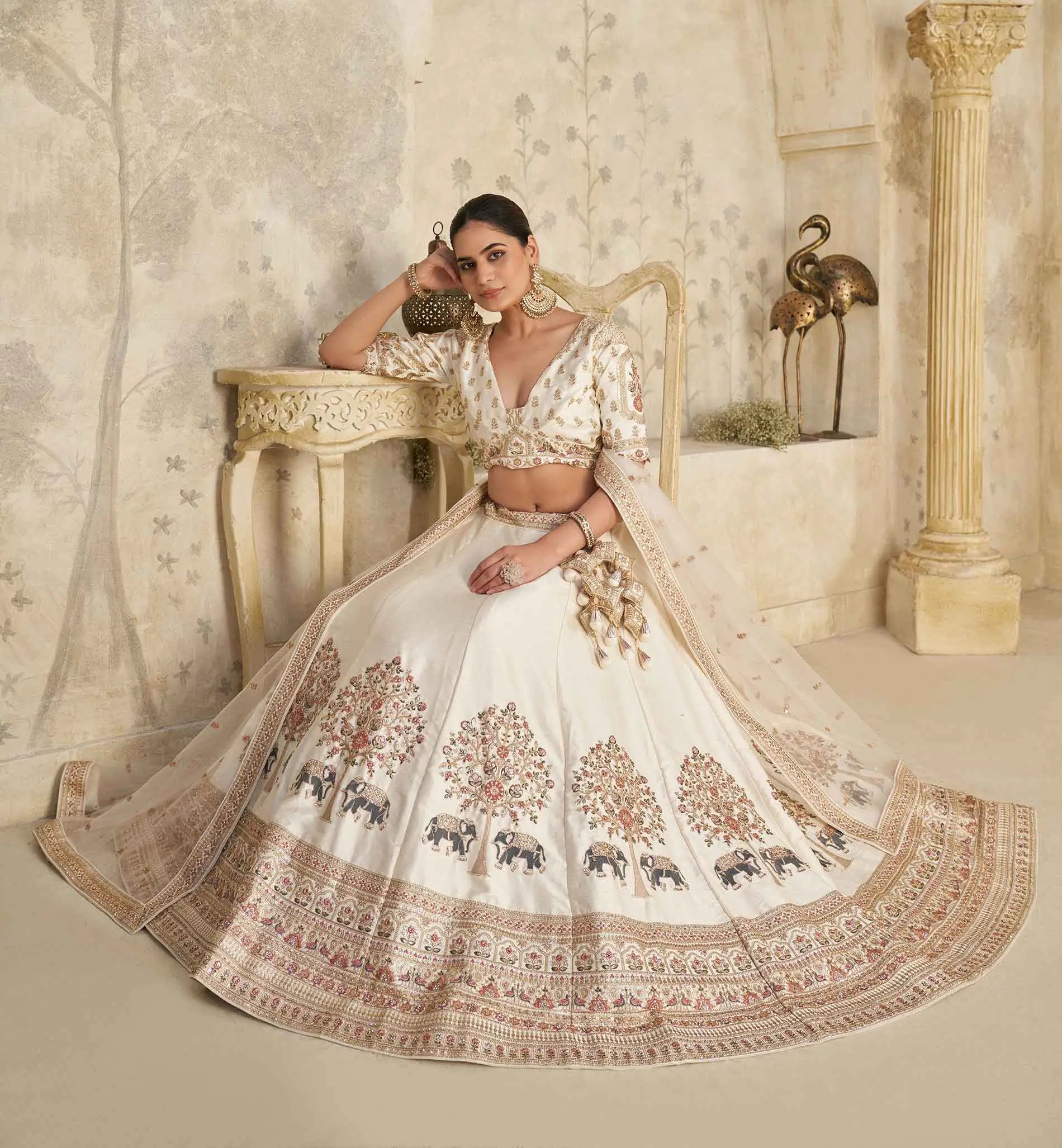 Cream Lehenga with Intricate Elephant Zari Work - qivii