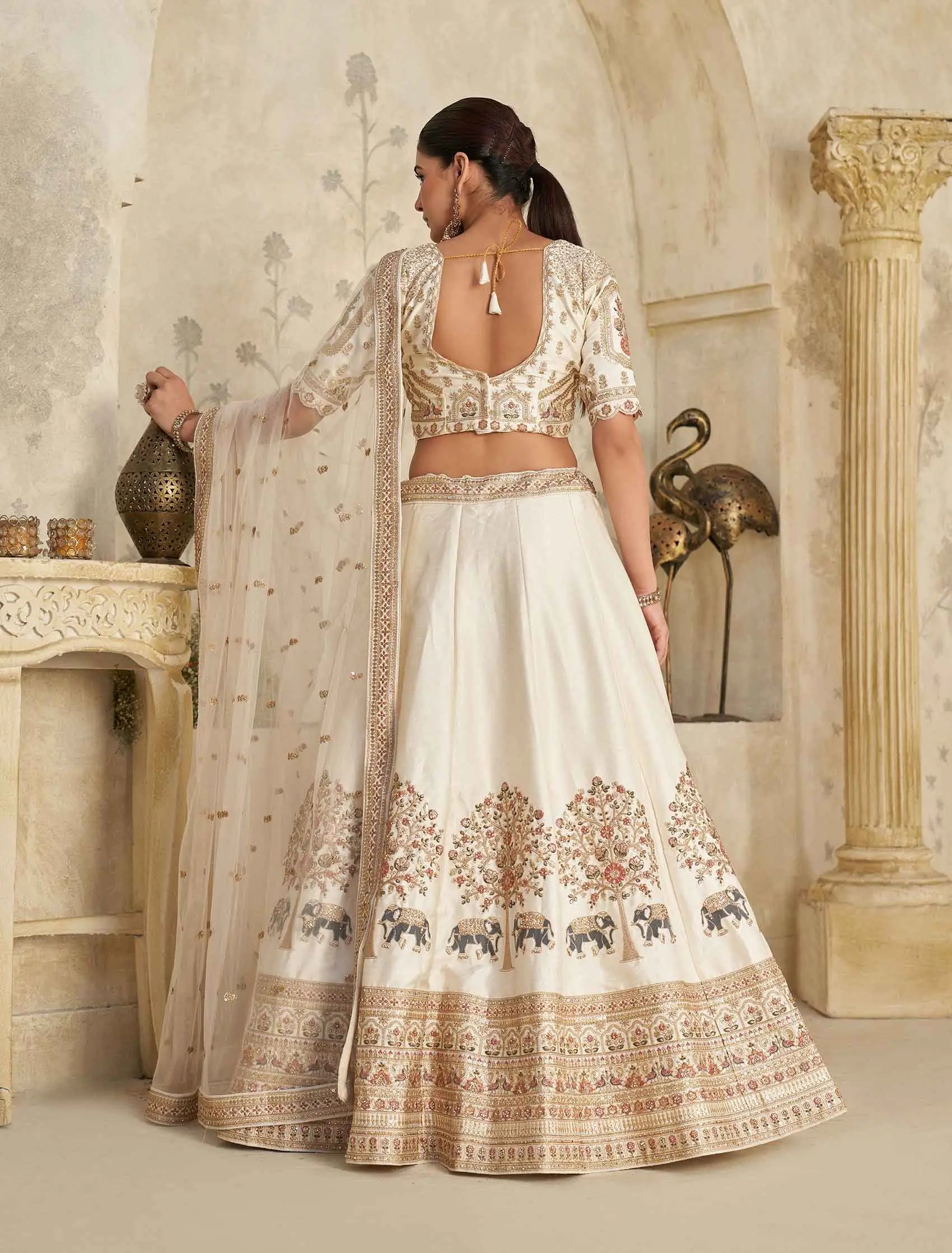 Cream Lehenga with Intricate Elephant Zari Work - qivii