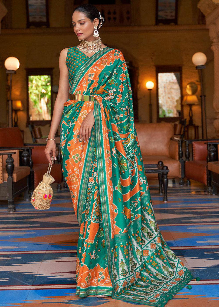 Green & Orange Printed Patola Silk Saree with Zari Border & Tassels on Pallu | Stitched Blouse - qivii