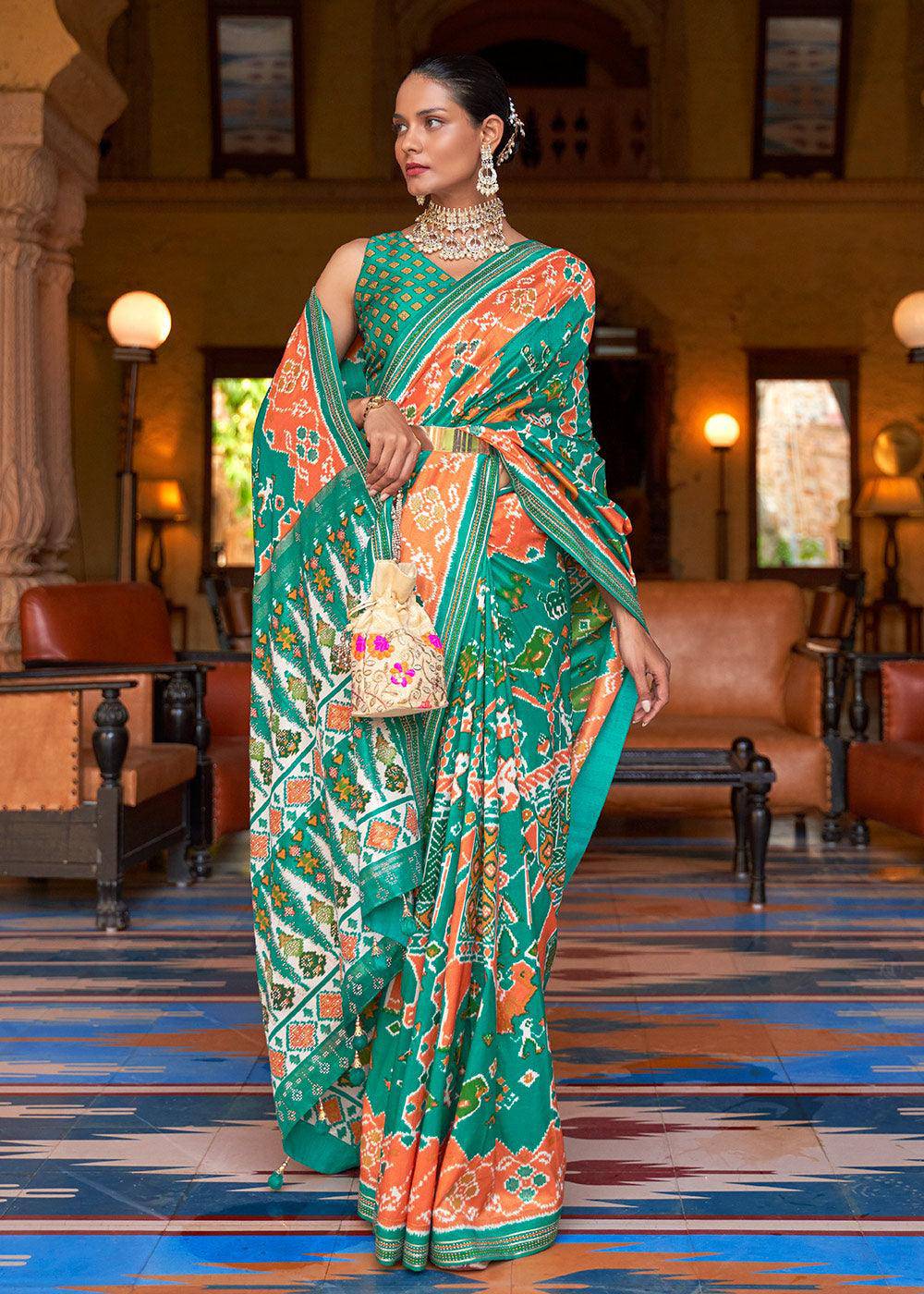 Green & Orange Printed Patola Silk Saree with Zari Border & Tassels on Pallu | Stitched Blouse - qivii