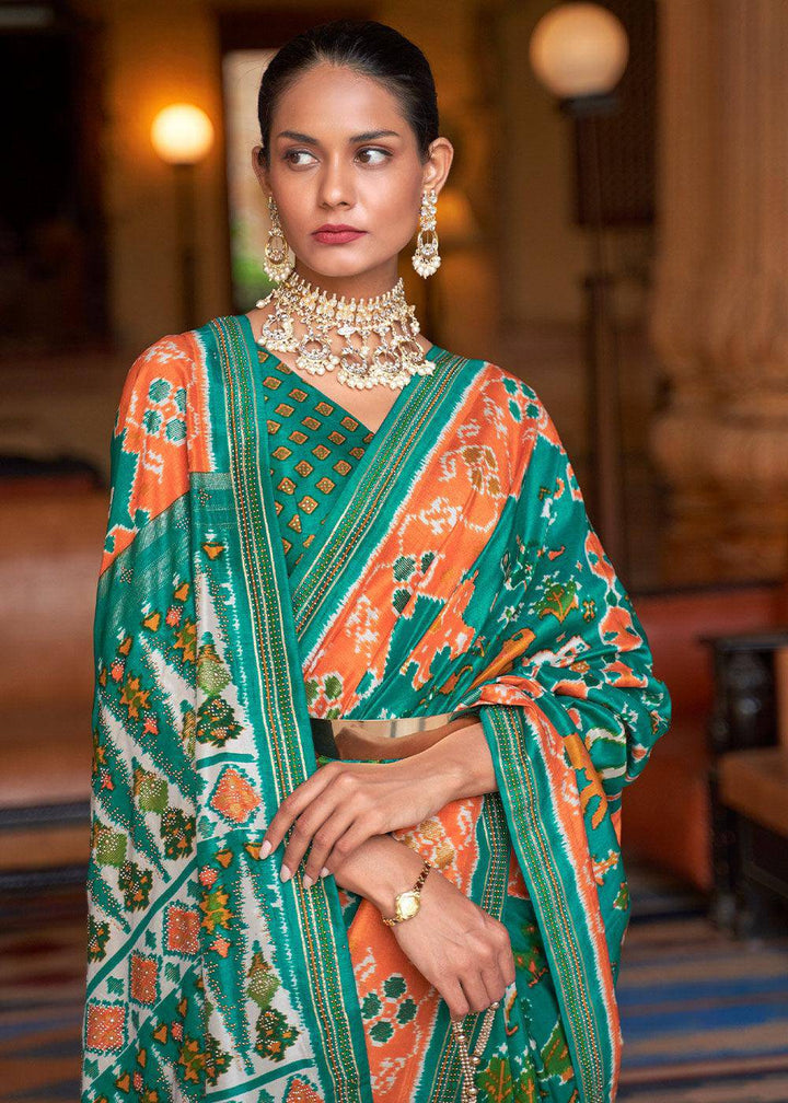 Green & Orange Printed Patola Silk Saree with Zari Border & Tassels on Pallu | Stitched Blouse - qivii