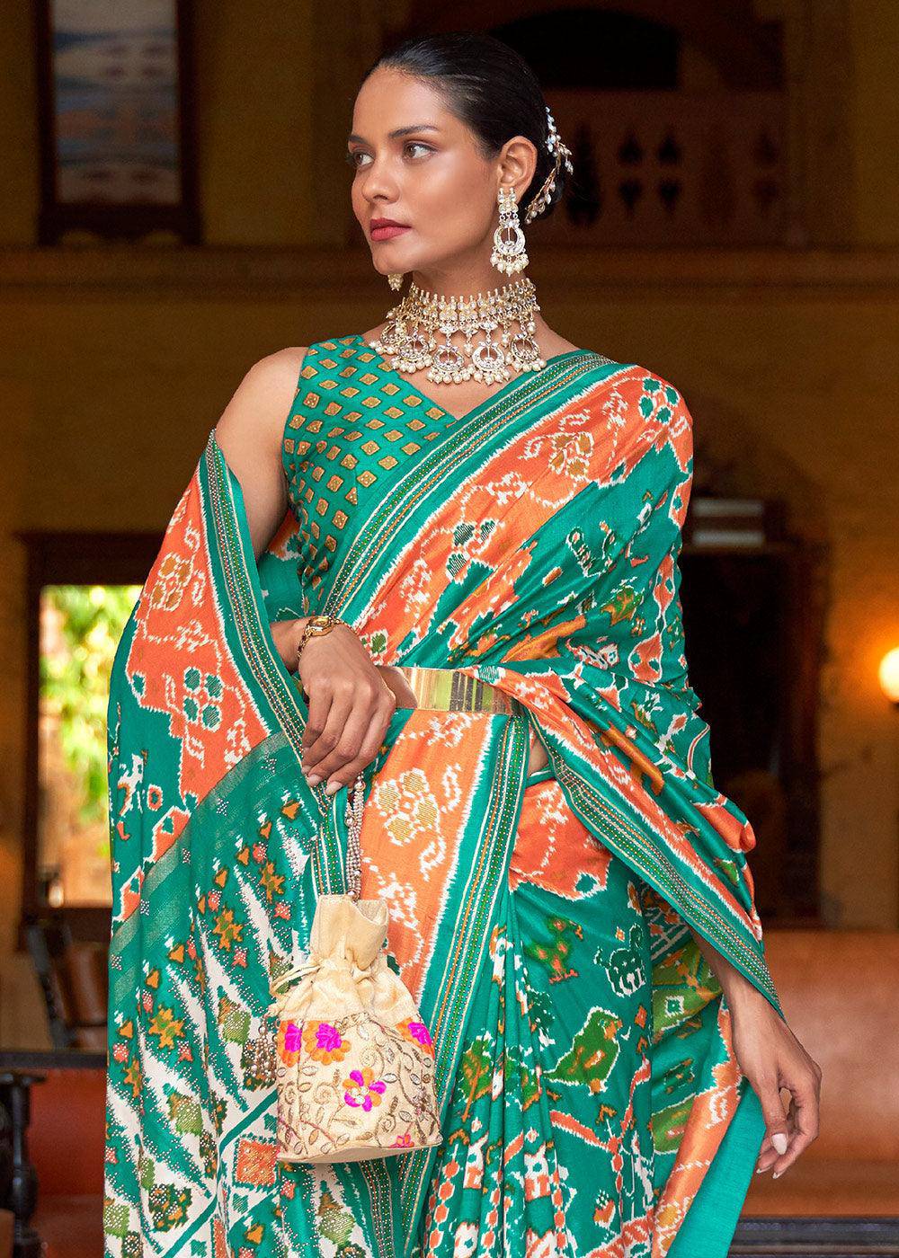 Green & Orange Printed Patola Silk Saree with Zari Border & Tassels on Pallu | Stitched Blouse - qivii