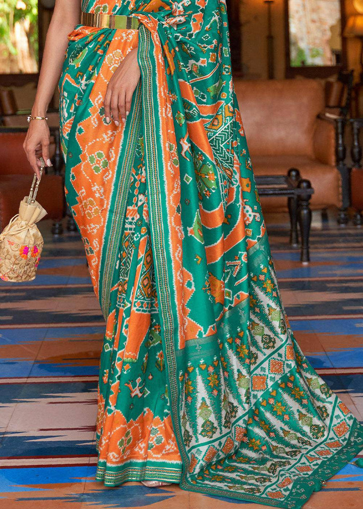 Green & Orange Printed Patola Silk Saree with Zari Border & Tassels on Pallu | Stitched Blouse - qivii