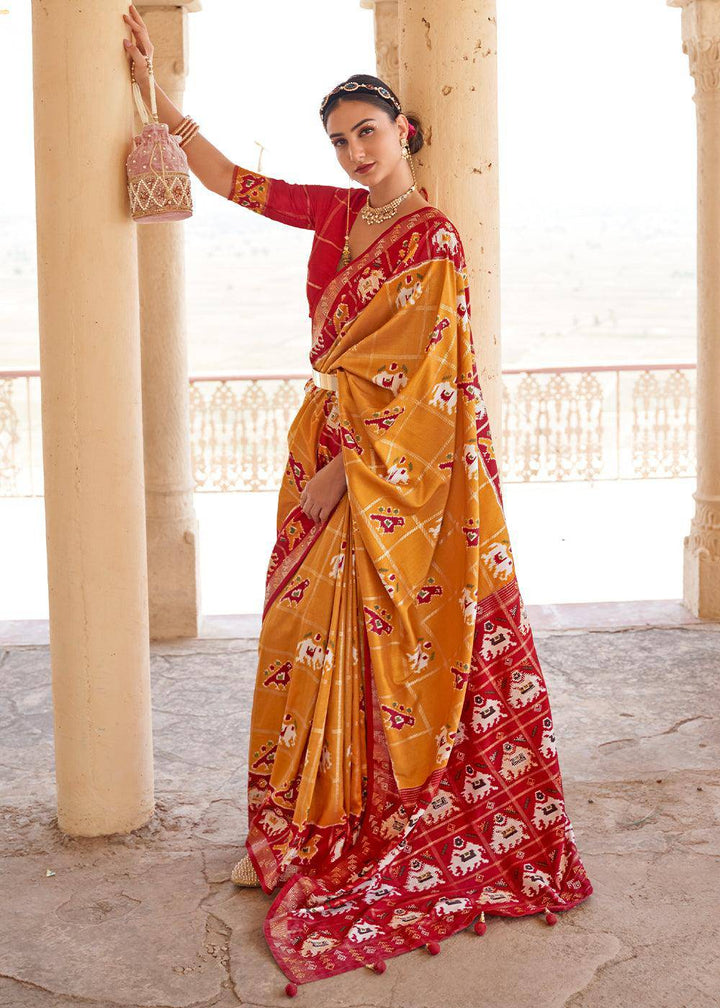 Honey Orange Printed Patola Silk Saree with Zari Border & Tassels on Pallu | Stitched Blouse - qivii