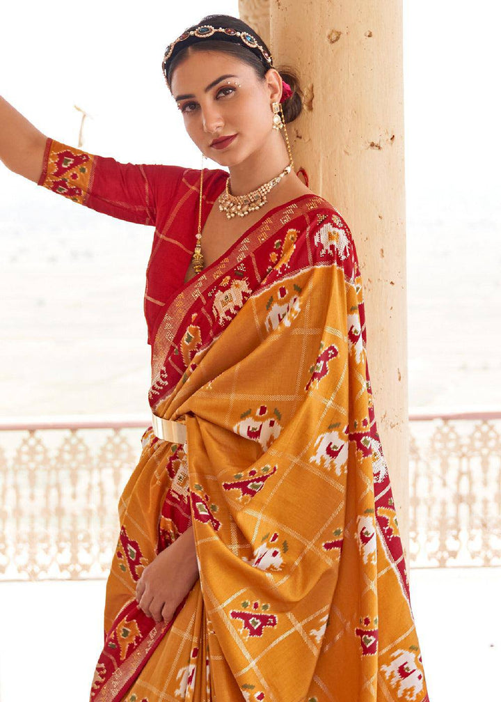 Honey Orange Printed Patola Silk Saree with Zari Border & Tassels on Pallu | Stitched Blouse - qivii