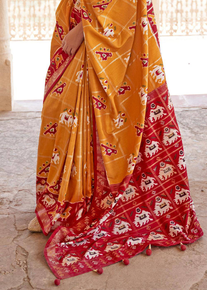 Honey Orange Printed Patola Silk Saree with Zari Border & Tassels on Pallu | Stitched Blouse - qivii