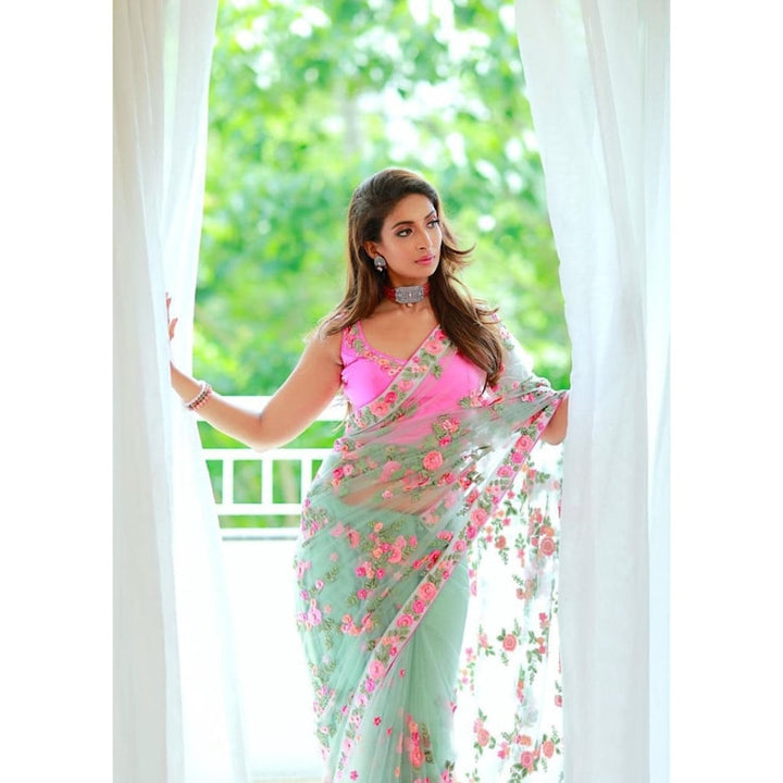 Indian bridesmaids wearing a stunning floral saree at a Mehendi festival