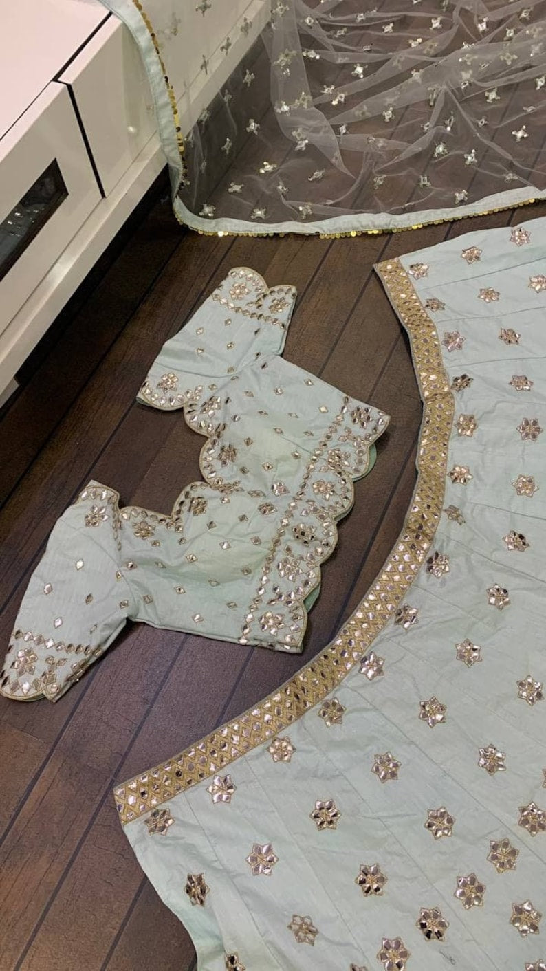 Beautiful Indian Silk Lehenga with intricate paper mirror work, zari work, and heavy embroidery sequence, perfect for weddings and parties - INSPIRED