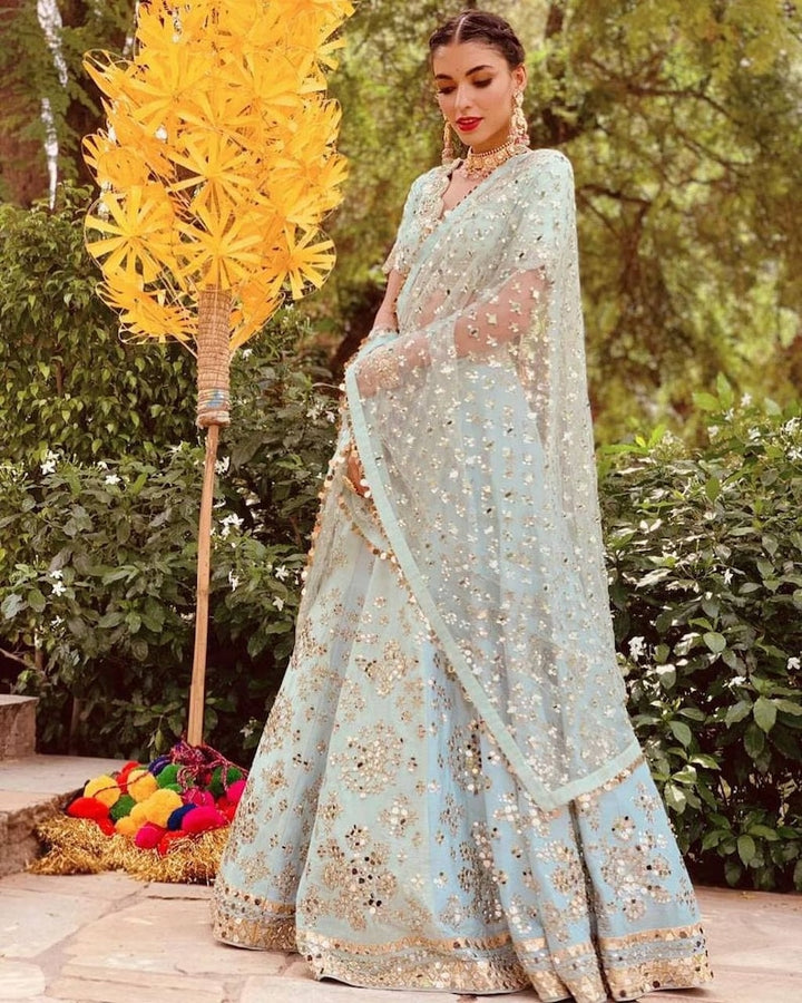 Stunning Indian silk lehenga featuring intricate paper mirror work, zari work, and heavy embroidery sequence work - perfect for weddings and parties INSPIRED