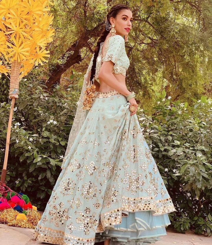 Beautiful Indian silk lehenga with paper mirror work and zari work, featuring heavy embroidery sequence work - perfect for weddings and parties