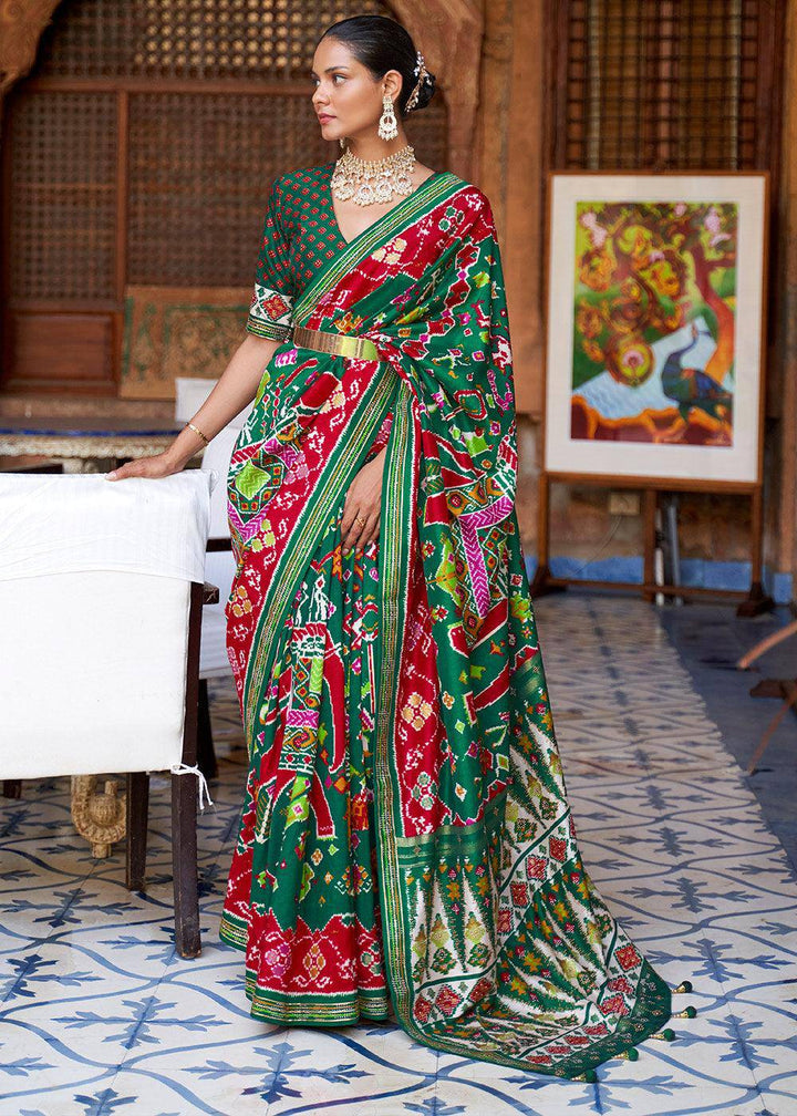 Jungle Green Printed Patola Silk Saree with Zari Border & Tassels on Pallu | Stitched Blouse - qivii